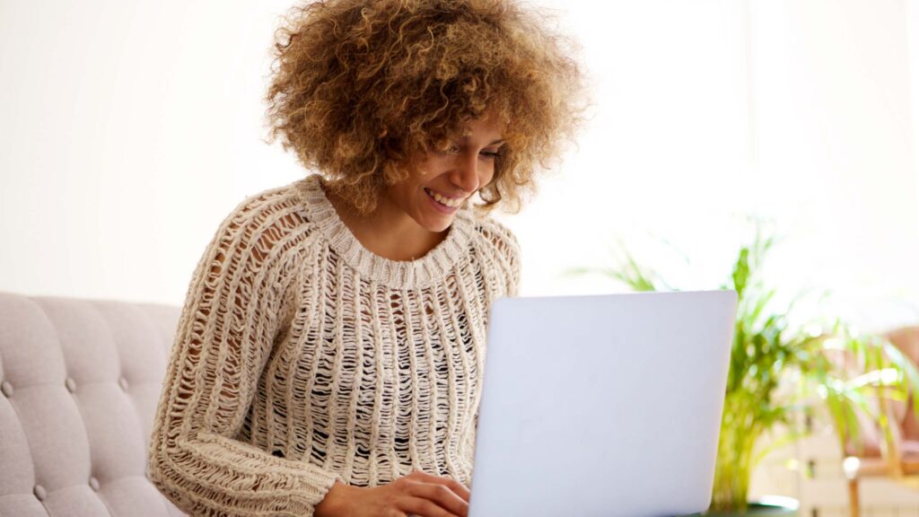 Smiling woman at computer